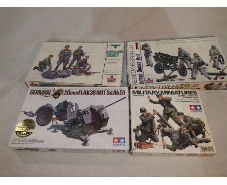 Four 1/35 scale military related kits, Esci Sprengpanzer Goliath and engines, Esci German smoke unit, Tamiya Flack 38, and Ta