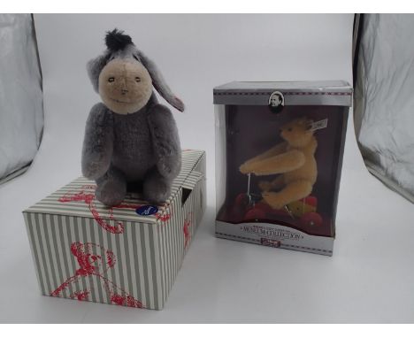 Two Steiff, a Mini Eyore, 683541 and a clockwork UR-Teddy 1926, 400919, both boxed with tags. UK P&amp;P Group 2 (£20+VAT for