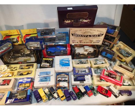 Sixty assorted diecast vehicles, various makes and scales, mostly very good to excellent condition, boxes have damp and stora