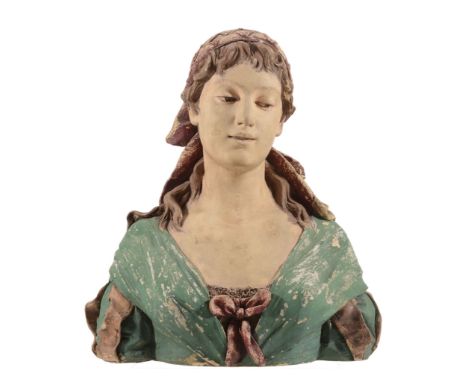 A Goldscheider terracotta bust of a young woman, a scarf around her head  A Goldscheider terracotta bust of a young woman,   