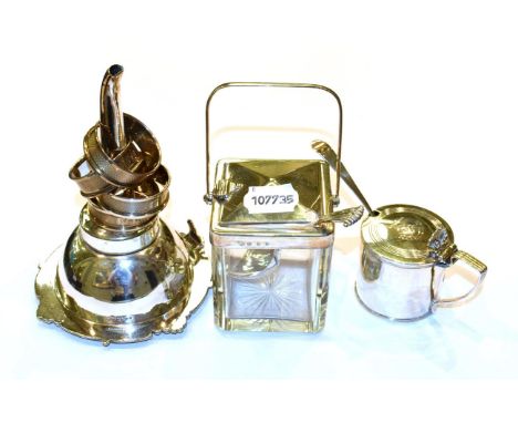 A silver and glass sugar jar, lift action lid, Goldsmiths &amp; Silversmiths Co together with assorted spoons, a George III m