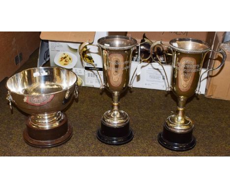 Two twin handled silver plated trophy cups, and a silver plated trophy bowl with ring and lion mask handles (3)