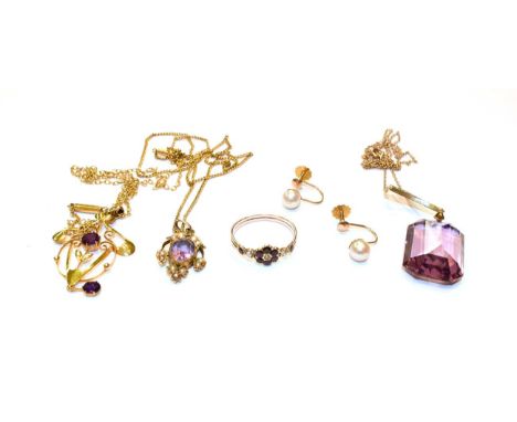 An amethyst and seed pearl pendant on chain, stamped '9CT', an amethyst pendant on chain, stamped '9C', a purple glass pendan