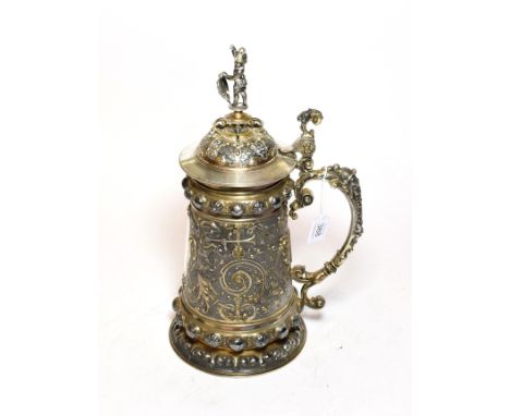 A German parcel gilt silver plate tankard, by WMF, late 19th/early 20th century, tapering cylindrical and with scroll handle,