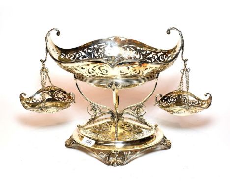 A silver plate centrepiece epergne, late 19th/early 20th century, on oval base with openwork foliage and shell feet, with a c