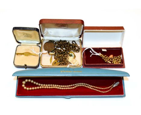 A small collection of jewellery including a tie pin stamped '9CT'; a curb link bracelet hung with a coral charm, stamped '15C