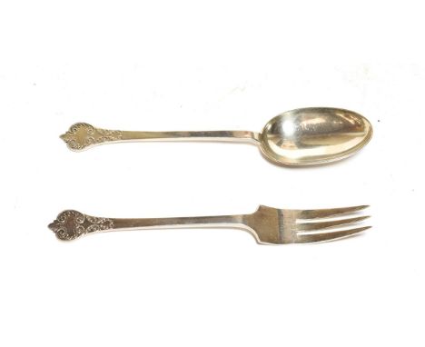 A George V silver serving spoon and fork, by Thomas Bradbury, Sheffield, 1933, Trefid pattern with lace back, the spoon 24cm 