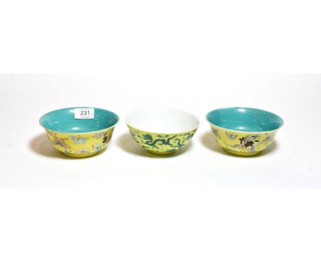 A pair of Chinese yellow ground bowls, decorated with insects and butterflies, bearing six character mark to base, together w