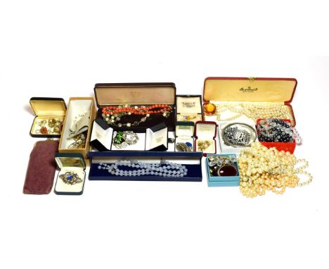 A quantity of costume jewellery including simulated pearl necklaces, marcasite brooches, beaded necklaces, a plated wristwatc