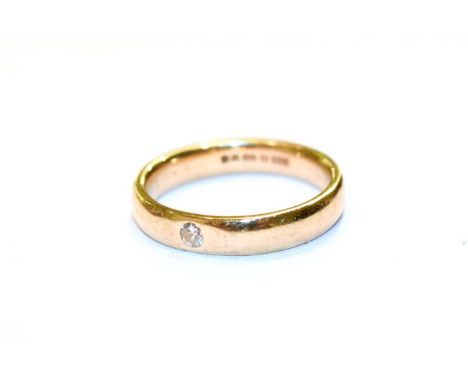 A 9 carat gold diamond band ring, finger size N.  Gross weight 3.8 grams.