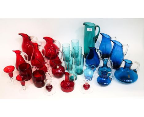 Whitefriars - A Group of Glass Jugs, Candlesticks and Mugs, in ruby, blue and green, various pattern and sizes (28)