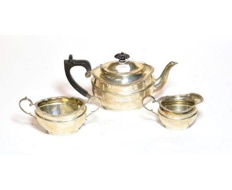 A three-piece George V silver tea-service, by David Landsborough Fullerton, London, 1919, each piece shaped oval and with gad