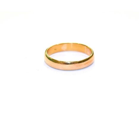 A 22 carat gold band ring, finger size U.  Gross weight 