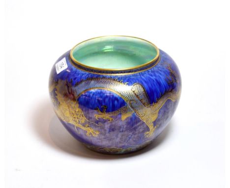 Daisy Makeig-Jones: A Wedgwood dragon lustre jardiniere with mottled blue ground, decorated with dragons and flaming pearl, g