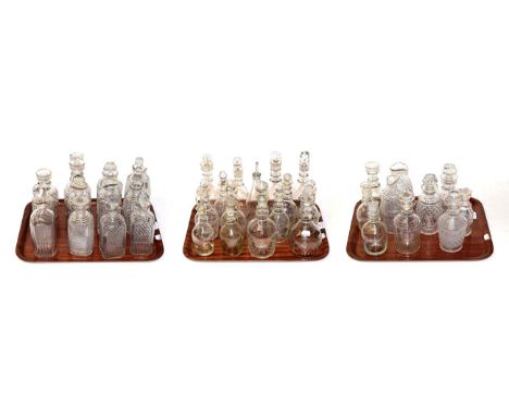 A quantity of early 19th century and later decanters and liqueur bottles including triple-ring neck and cut glass examples (t