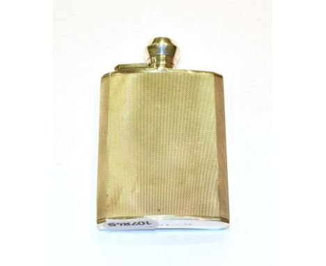 A George VI silver hip-flask, by F. Burton Crosbee, Birmingham, 1939, oblong and with engine turned decoration, with bayonet 