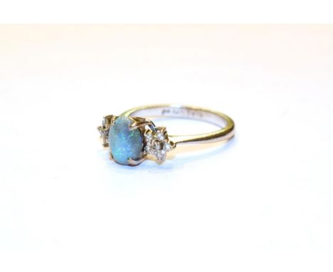 An opal and diamond ring, stamped '18CT', finger size O1/2.  Gross weight 3.1 grams