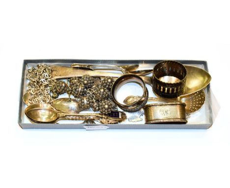 A small quantity of silver teaspoons, a serving spoon, napkin rings, child's bracelet, necklace, two bracelets and matching e