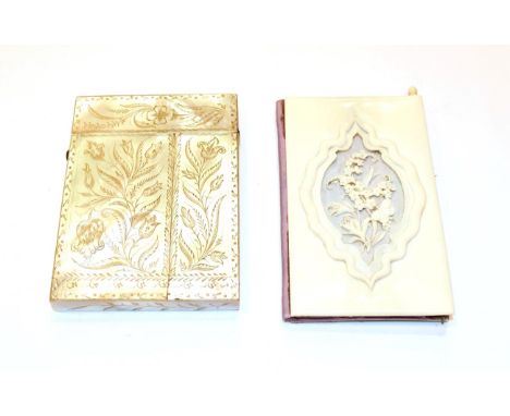 An ivory card-case, oblong, the cover carved with flowers and a butterfly, the base plain opens to reveal two concertina comp