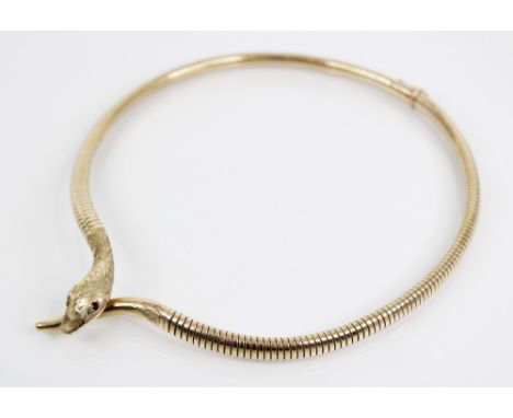 A 9ct gold snake necklace by Smith & Pepper, Birmingham 1960, the head and tail with engraved detail and garnet set eyes, coi