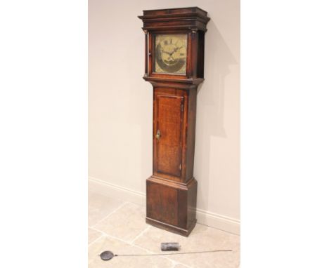 A George III oak cased thirty hour longcase clock, by Joseph Smith, Wrexham, the flat top hood with freestanding pillars flan