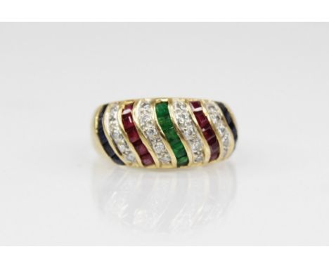 A sapphire, ruby, emerald and diamond 18ct gold bombe ring, designed as alternating waved bands of princess cut rubies, emera