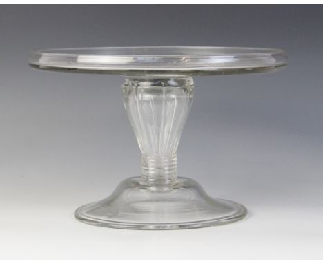 A glass tazza, late 18th century, the flat galleried top raised on a reeded lobed hollow stem of inverted baluster form termi