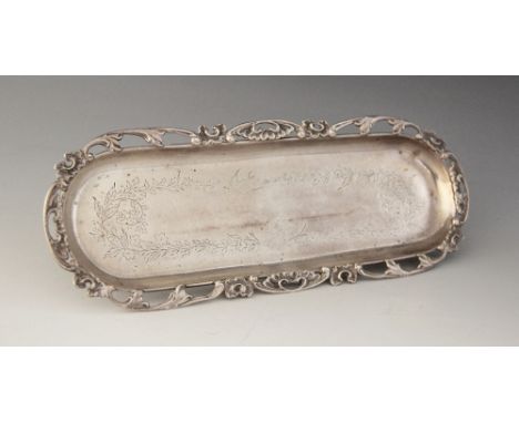 An Edwardian silver pin tray, Levi &amp; Salaman, Birmingham 1906, the lozenge form tray with pierced foliate border, engrave