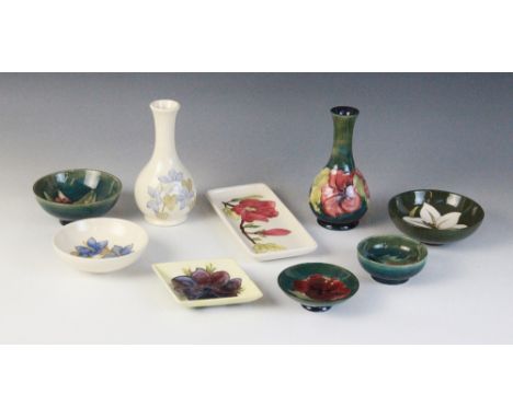 A selection of Moorcroft Pottery pieces, to include a stem vase, 16cm high, a small bowl, 11cm diameter, and two trinket dish