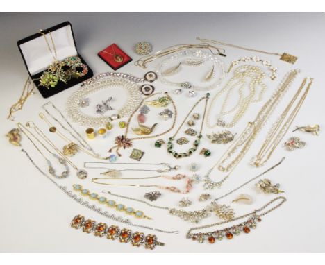 A large quantity of vintage costume jewellery and accessories, including paste set suites, gold coloured brooches, silver nap