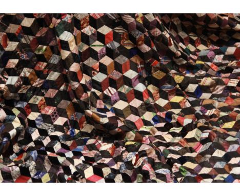 A large Victorian style patch work quilt bedspread/cover, in rhombus cube pattern formed from multiple coloured fabrics, 260c