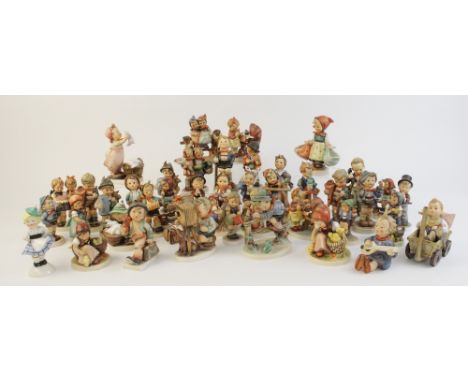 Four Hummel figurines, each with TMK-2 mark, including "Happy Wanderer", with thirty nine later Hummel figurines with TMK-3 a