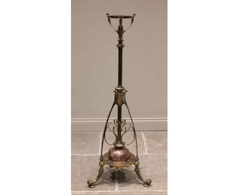 A late 19th/early 20th century brass and copper Art Nouveau telescopic standard lamp, the central adjustable column extending