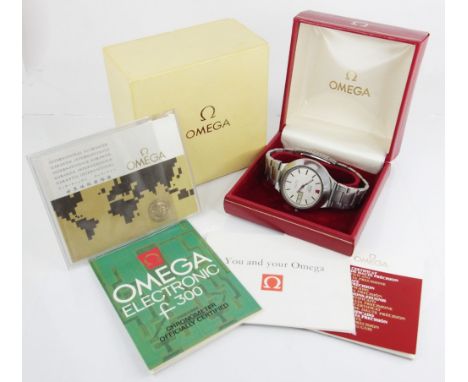 An Omega Seamaster Electronic F300 Hz chronometer, circular brushed dial with baton markers, day and date windows to three o'