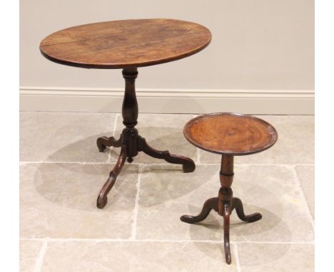 A George III fruitwood tripod table, the oval top with moulded detail to the edge, raised upon a baluster pedestal extending 