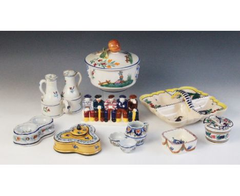 A Continental tin glazed oil and vinegar cruet, each with floral sprigged decoration 14cm high (at fault) with a French trefo