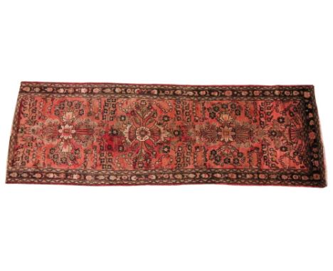 An Iranian runner, with triple cross shaped foliate medallions on a faded red field, within three trailing borders, 254cm x 8
