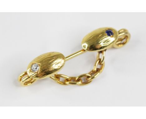 A Victorian diamond and sapphire brooch, probably converted from a cufflink, designed as two oval panels with woodgrain effec