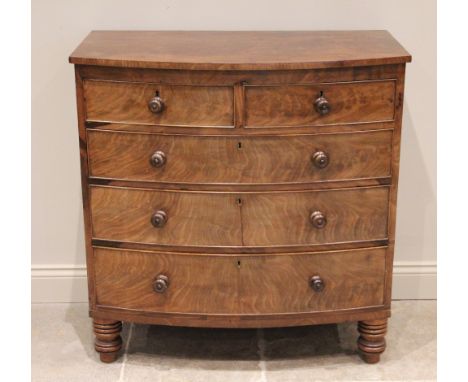 A mid 19th century bow front mahogany chest of drawers, formed from two short over three long graduated and cock beaded drawe