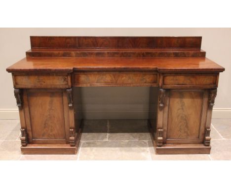 A mid 19th century twin pedestal mahogany chiffonier/sideboard, the stepped galleried back upon an inverted breakfront top wi