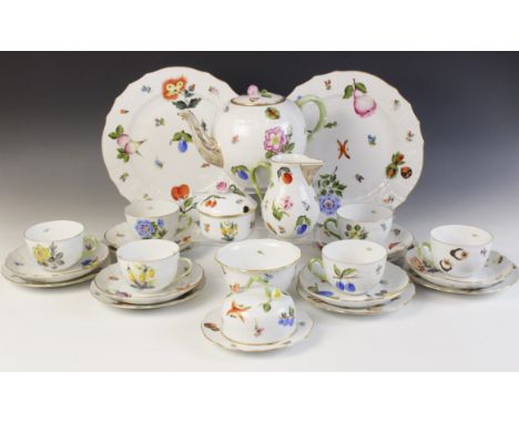 A Herend Hungary hand painted tea service, comprising: a teapot and cover, a milk jug, a sucrier and cover, a butter dish, a 