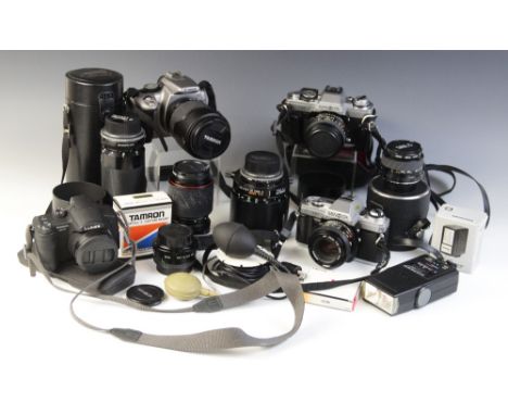 A collection of 35mm camera equipment, comprising: a Minolta XG-M 35mm single lens reflex camera, fitted with a Minolta MD 50