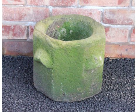A 19th century sandstone planter, of octagonal form with four lug handles, 26cm H x 28cm W 