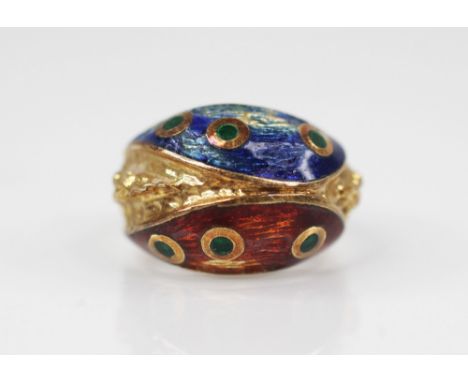 A continental enamel dress ring, the abstract design ring decorated in red, blue and green enamels with textured detail to sh