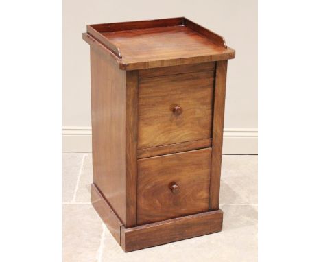 A Victorian mahogany bedside cupboard, the three quarter galleried top above a cupboard door and sliding commode base with in