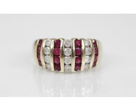 A ruby and diamond 9ct gold bombe ring, the head designed as alternating rows of brilliant cut diamond and round mixed cut ru