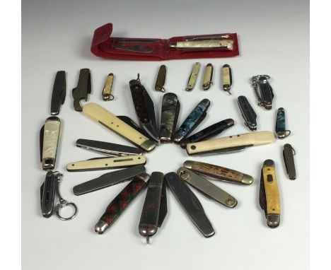 A rummage tray of various antique and vintage collectables, to include silver cutlery, comprising of sugar tongs; fiddle patt