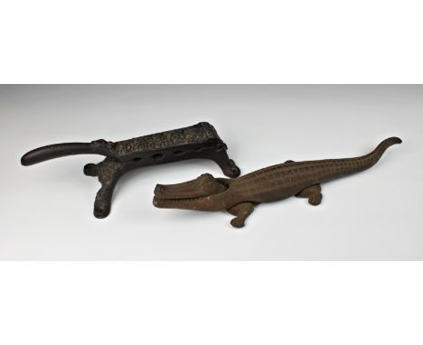 An antique cast iron wine bottle cork or apothecary press, stamped Clark &amp; C., together with a cast iron novelty crocodil