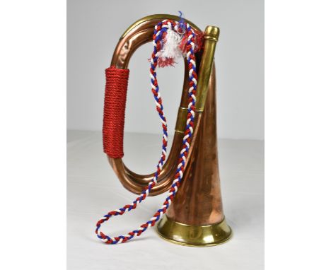 A brass and copper bugle, stamped John Grey &amp; Sons, together with a Lancashire Fusiliers cap badge and level. (3)
