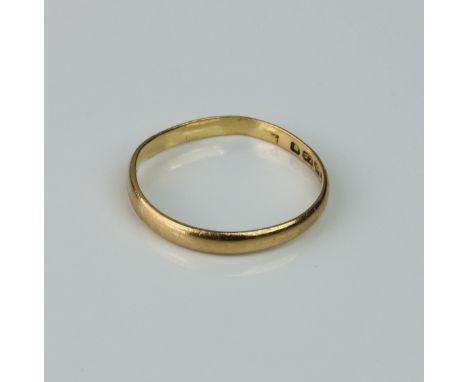 A 22ct gold wedding band, hallmarked Birmingham 1933, size K.